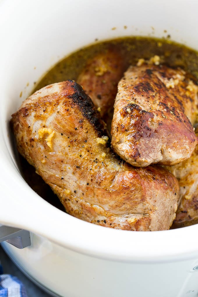 Slow Cooker Pork Tenderloin Recipe | Crock Pot Pork Tenderloin | Easy Pork Tenderloin #slowcooker #crockpot #pork #dinner #sadud Seared pork tenderloin in a slow cooker with seasonings.