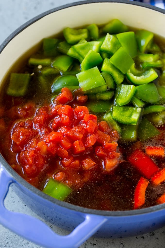 Stuffed Pepper Soup Recipe | Beef and Rice Soup | Stuffed Peppers #peppers #soup #beef #rice #dinner #sadud Ground beef, tomatoes, peppers and beef broth in a pot.