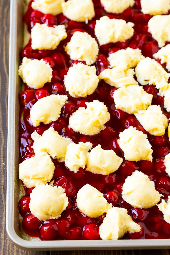 Cherry Bars Recipe | Cherry Pie Bars | Cherry Cookies | Bar Cookies #cookies #bars #cherry #baking #dessert #sweets #sadud Filling with dollops of cookie dough on top.