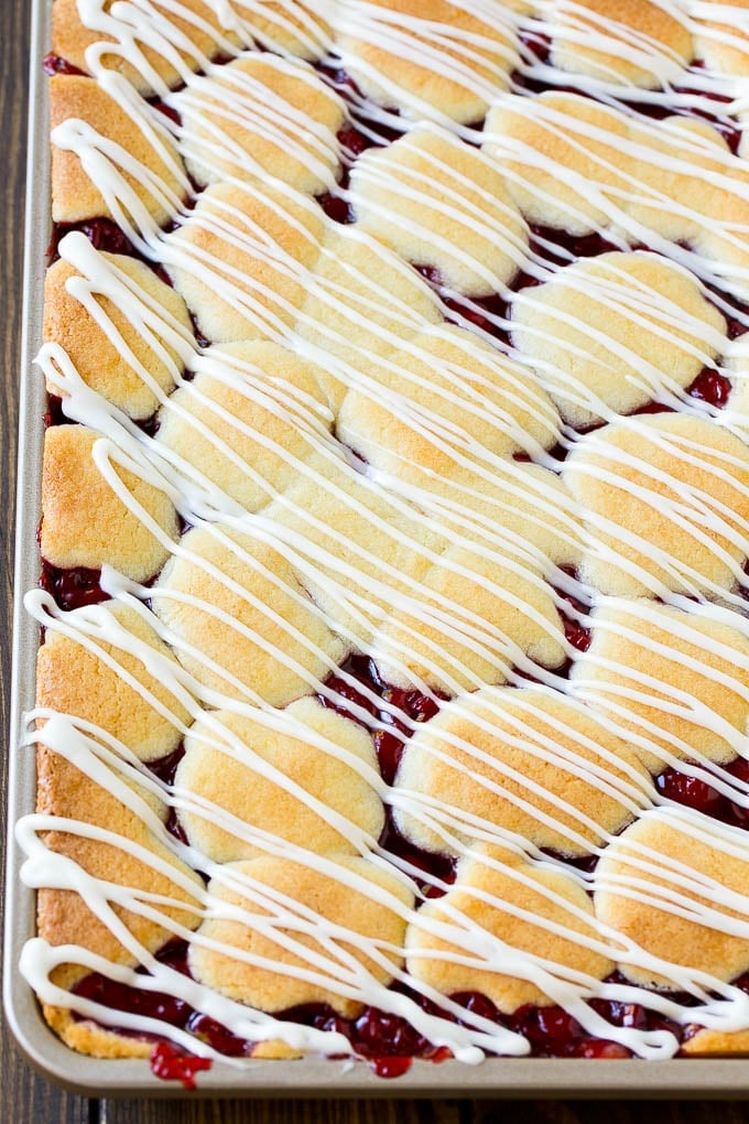 Cherry Bars Recipe | Cherry Pie Bars | Cherry Cookies | Bar Cookies #cookies #bars #cherry #baking #dessert #sweets #sadud Cherry bars topped with vanilla glaze.