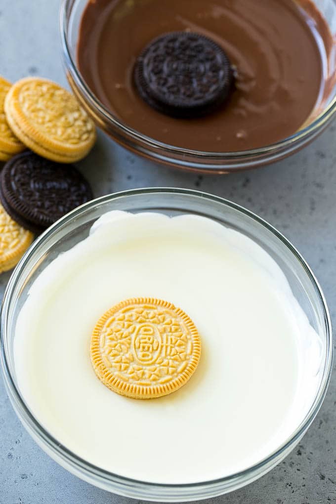 Chocolate Covered Oreos Recipe | Oreo Cookies | Chocolate Dipped Oreos #oreo #cookies #chocolate #sprinkles #dessert #sadud Cookies being dipped into dark and white chocolate.