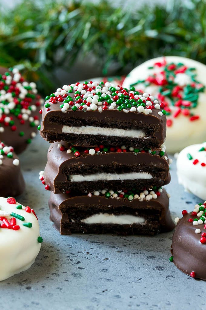 Chocolate Covered Oreos Recipe | Oreo Cookies | Chocolate Dipped Oreos #oreo #cookies #chocolate #sprinkles #dessert #sadud A stack of chocolate covered Oreos.