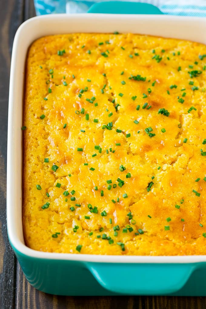 Corn Pudding Recipe | Corn Casserole | Corn Side Dish #corn #pudding #casserole #sidedish #thanksgiving #dinner #sadud A casserole dish of corn pudding topped with chives.