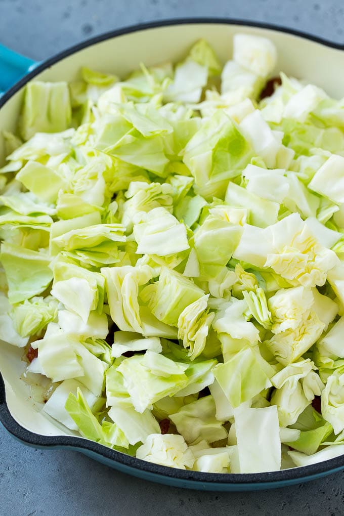 Fried Cabbage Recipe | Cabbage with Bacon | Cabbage Side Dish #cabbage #bacon #sidedish #lowcarb #keto #sadud Bacon, onions and cabbage in a skillet.