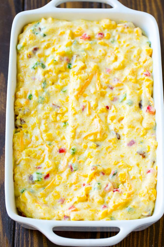 Loaded Corn Casserole Recipe | Easy Corn Casserole | Bacon Corn Casserole | Corn Pudding #corn #casserole #bacon #cheese #sidedish #thanksgiving #dinner #sadud Uncooked batter in a baking dish.
