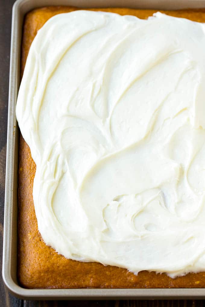 Pumpkin Bars Recipe | Pumpkin Cake | Pumpkin Dessert #pumpkin #fall #dessert #sadud #thanksgiving Cream cheese frosting spread over cake.