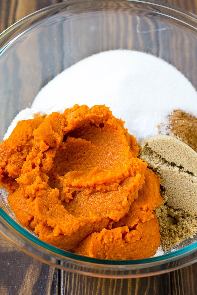 Pumpkin Bars Recipe | Pumpkin Cake | Pumpkin Dessert #pumpkin #fall #dessert #sadud #thanksgiving Pumpkin puree, brown sugar and flour in a bowl.