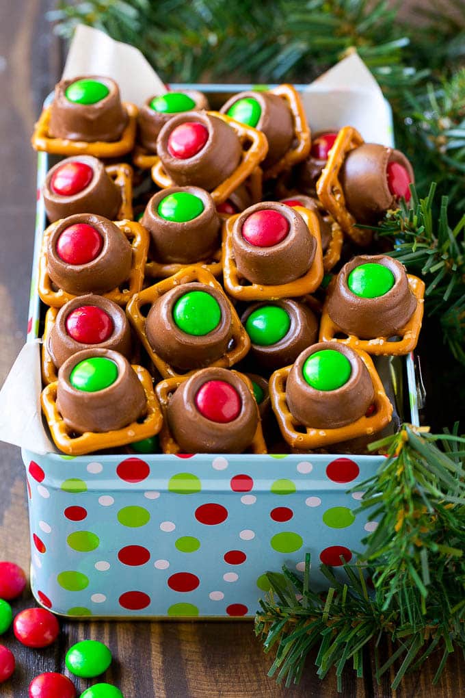 Rolo Pretzels Recipe | Chocolate Pretzels | Caramel Pretzels | Holiday Candy #christmas #baking #dessert #candy #chocolate #caramel #pretzels #sadud A gift tin full of Christmas colored Rolo pretzels.