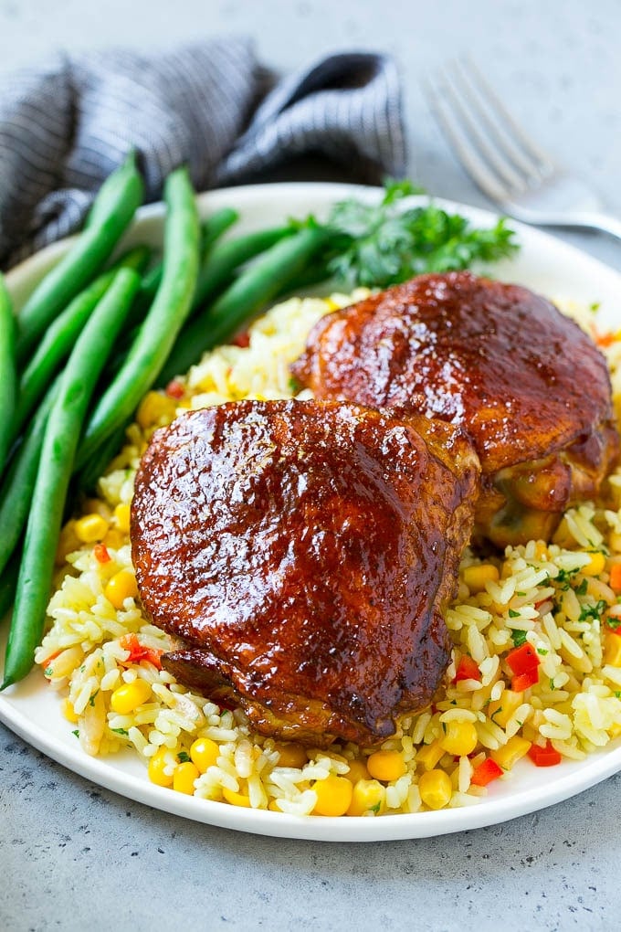 Smoked Chicken Thighs Recipe | Barbecue Chicken Thighs | Easy Chicken Thighs #chicken #barbecue #smoker #dinner #sadud A serving of smoked chicken thighs served with rice and green beans.