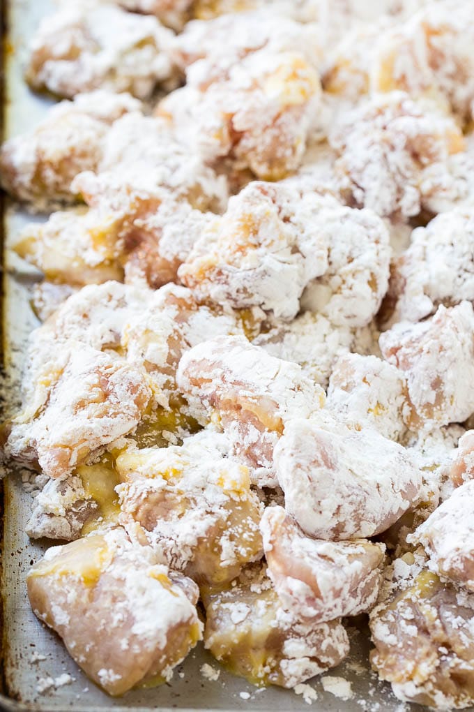 Sweet Chili Chicken Recipe | Thai Chicken | Asian Chicken #chicken #thaifood #chili #dinner #sadud Chicken pieces coated in egg and flour.