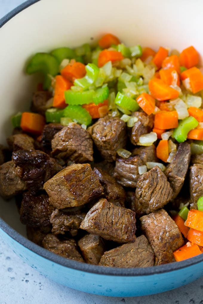 Beef Barley Soup Recipe | Beef Soup | Barley Soup #soup #beef #dinner #vegetables #sadud #comfortfood Stew meat, carrots, onions and celery in a large pot.