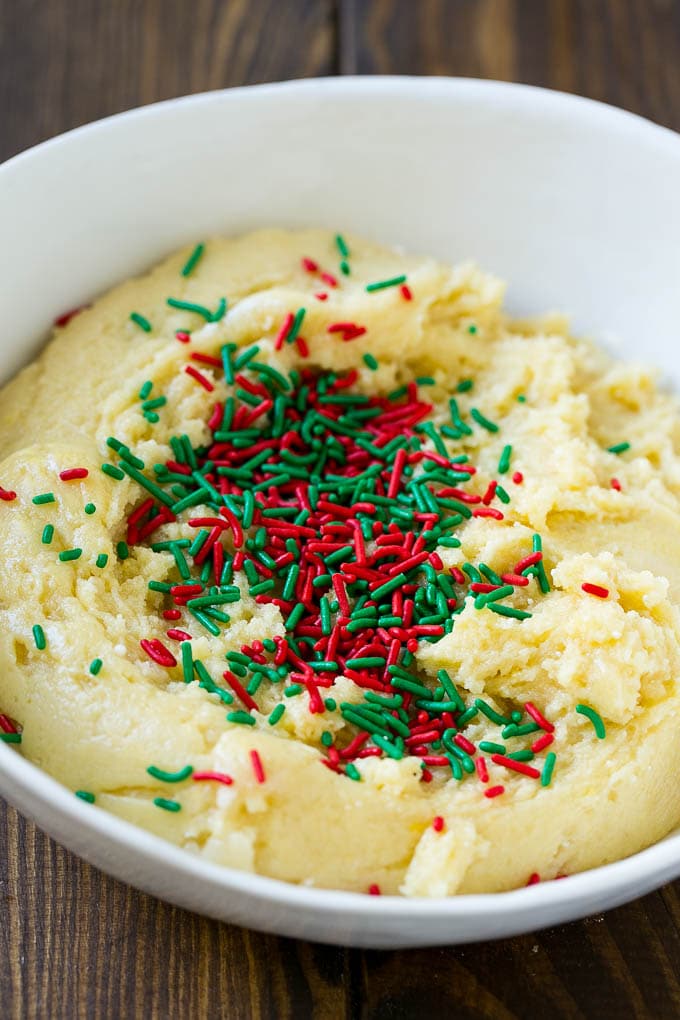 Cake Mix Cookies Recipe | Sprinkle Cookies | Christmas Cookies #cookies #christmas #sprinkles #dessert #baking #sadud A bowl of dough with sprinkles on top.