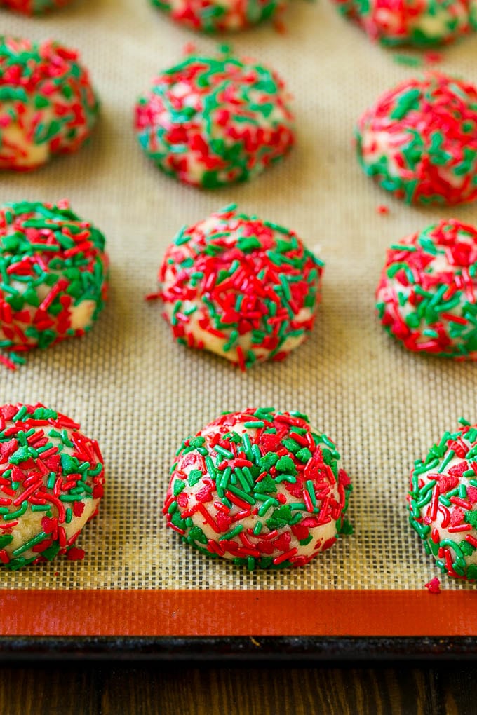 Cake Mix Cookies Recipe | Sprinkle Cookies | Christmas Cookies #cookies #christmas #sprinkles #dessert #baking #sadud Balls of dough rolled in sprinkles.
