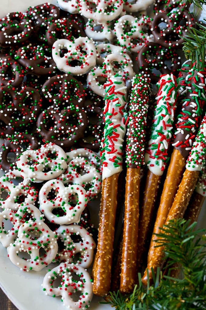 Chocolate Covered Pretzels Recipe | Sprinkle Pretzels | No Bake Dessert #pretzels #chocolate #christmas #sprinkles #candy #sadud Chocolate covered pretzel twists and rods on a serving platter.