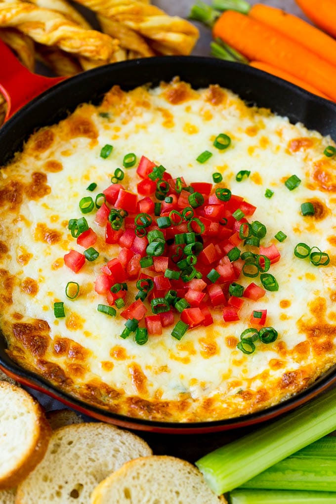 Crab Dip Recipe | Hot Crab Dip | Seafood Dip #dip #crab #seafood #appetizer #sadud #cheese Hot crab dip in a skillet topped with tomatoes and green onions.