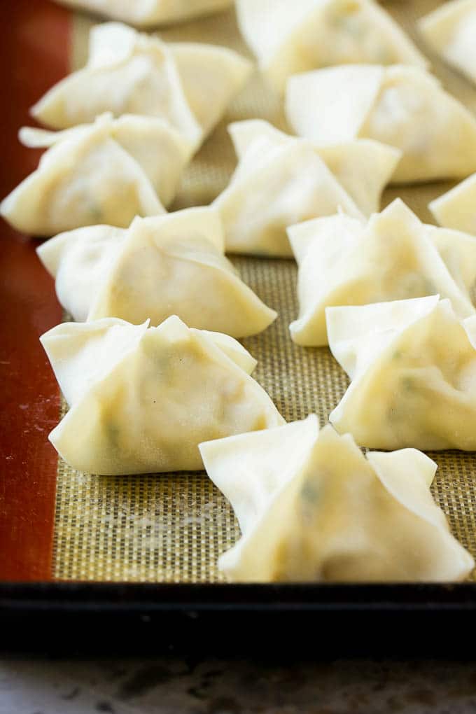 Crab Rangoon Recipe | Crab Wontons | Cream Cheese Wontons #crab #cheese #appetizer #snack #chinesefood #dinner #sadud Raw wontons ready to go into the fryer.
