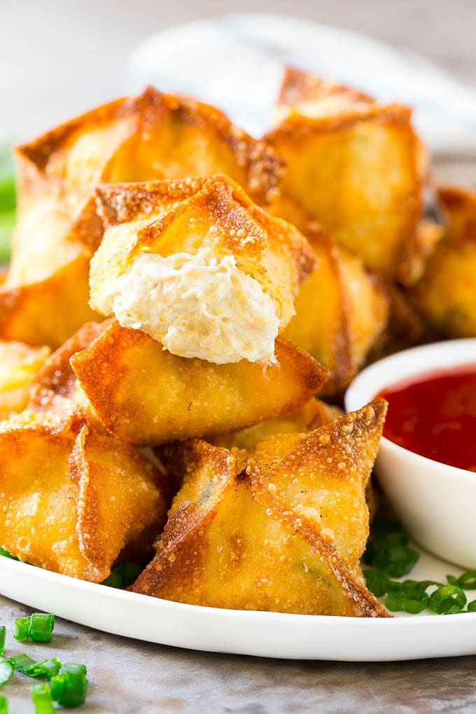 Crab Rangoon Recipe | Crab Wontons | Cream Cheese Wontons #crab #cheese #appetizer #snack #chinesefood #dinner #sadud A cross section of crab rangoon with crispy wontons stuffed with cream cheese and crab.