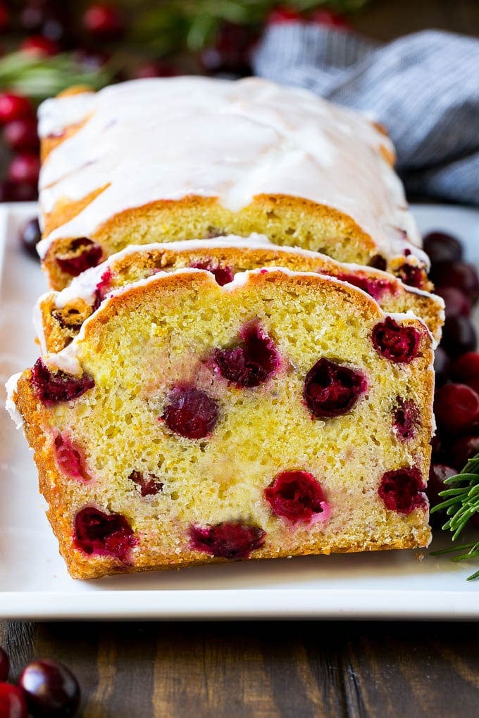 Cranberry Bread Recipe | Cranberry Loaf | Cranberry Orange Bread #cranberry #bread #baking #dessert #fall #sadud Sliced cranberry bread on a serving plate.