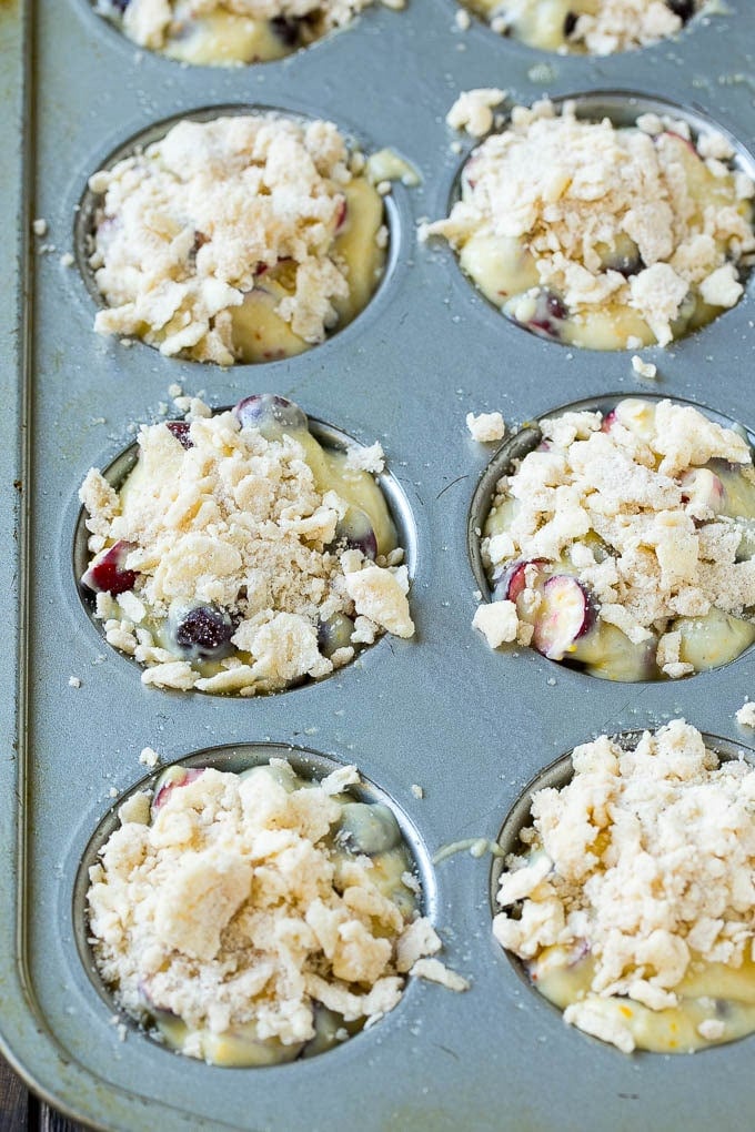 Cranberry Muffins Recipe | Cranberry Orange Muffins #cranberry #muffins #orange #fall #dessert #sadud Muffins topped with streusel ready to go into the oven.
