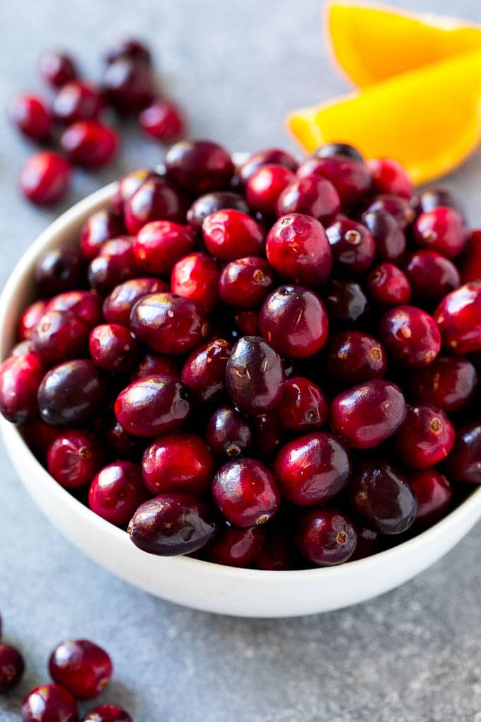 Cranberry Orange Sauce Recipe | Homemade Cranberry Sauce | Fresh Cranberry Sauce #cranberry #orange #fall #thanksgiving #sauce #dinner #sadud A bowl of fresh cranberries.
