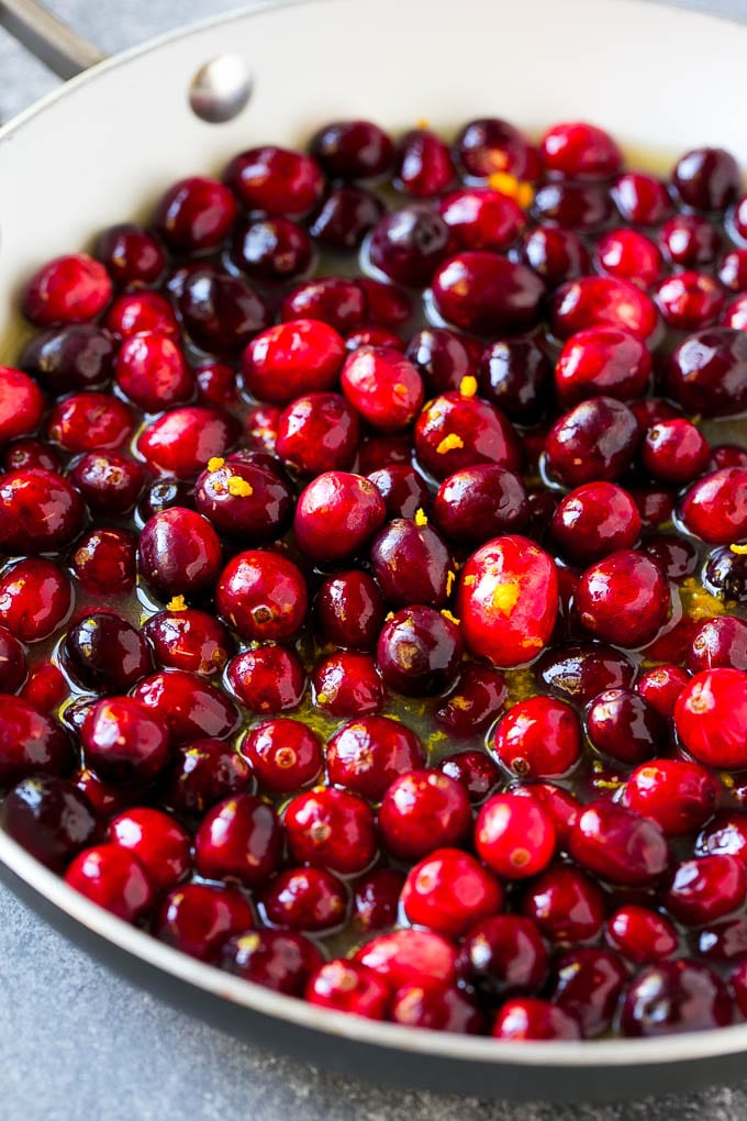 Cranberry Orange Sauce Recipe | Homemade Cranberry Sauce | Fresh Cranberry Sauce #cranberry #orange #fall #thanksgiving #sauce #dinner #sadud Berries in a skillet with orange juice, sugar and orange zest.