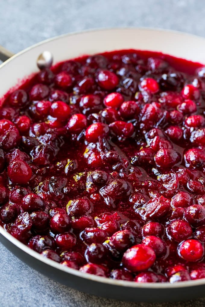 Cranberry Orange Sauce Recipe | Homemade Cranberry Sauce | Fresh Cranberry Sauce #cranberry #orange #fall #thanksgiving #sauce #dinner #sadud Cranberry orange sauce simmering in a skillet.