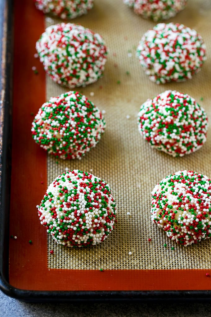 Gooey Butter Cookies Recipe | Cake Mix Cookies | Sprinkle Cookies | Christmas Cookies #cookies #butter #sprinkles #christmas #dessert #baking #sadud Balls of dough rolled in sprinkles.