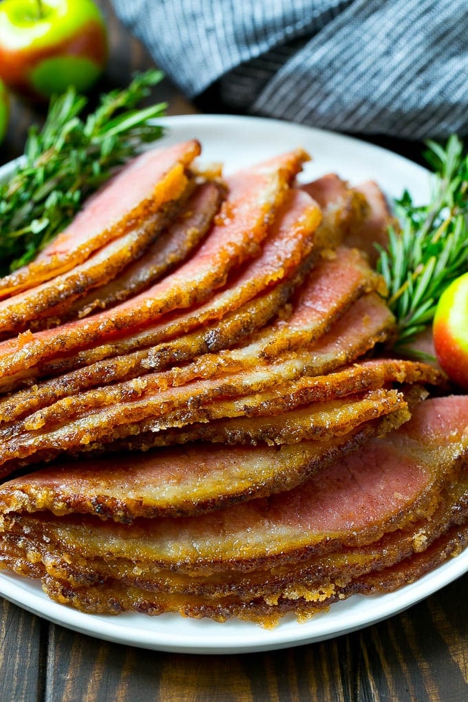 Honey Baked Ham Recipe | Glazed Ham | Holiday Ham #ham #dinner #sadud #christmas #thanksgiving #easter Sliced honey baked ham on a serving plate.
