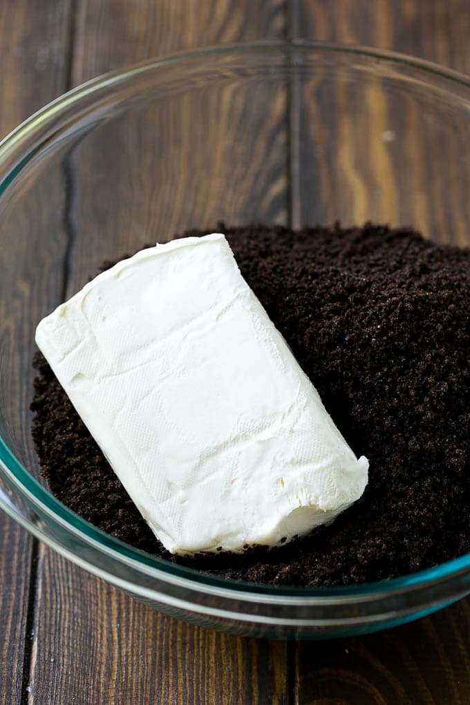 Oreo Balls Recipe | Oreo Truffles | Homemade Candy #truffles #candy #oreos #chocolate #sprinkles #dessert #christmas #sadud Cookie crumbs and cream cheese in a bowl.