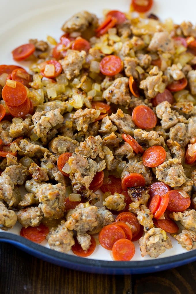 Pizza Pasta Recipe | Pepperoni Pasta | Sausage Pasta #italian #pepperoni #sausage #pizza #pasta #dinner #sadud #onepot A pan of cooked sausage, pepperoni and onions.