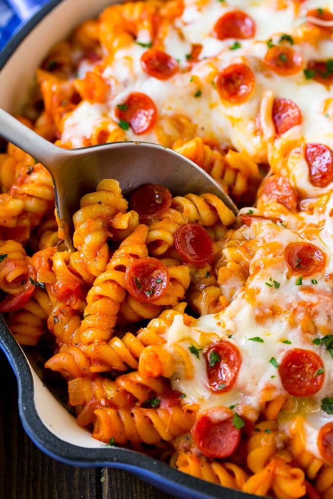 Pizza Pasta Recipe | Pepperoni Pasta | Sausage Pasta #italian #pepperoni #sausage #pizza #pasta #dinner #sadud #onepot A pan of pizza pasta with a serving spoon in it.