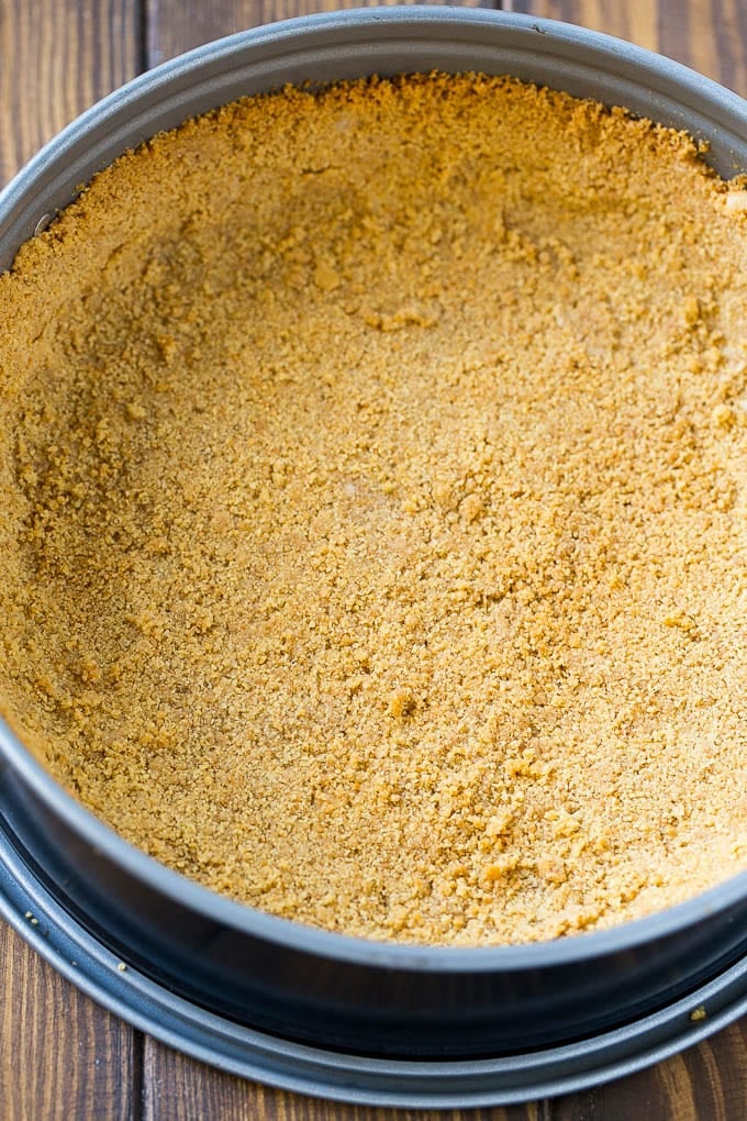 Pumpkin Cheesecake Recipe | Pumpkin Pie Cheesecake | Pumpkin Dessert #pumpkin #thanksgiving #dessert #cheesecake #fall #sadud A graham cracker crust pressed inside a springform pan.