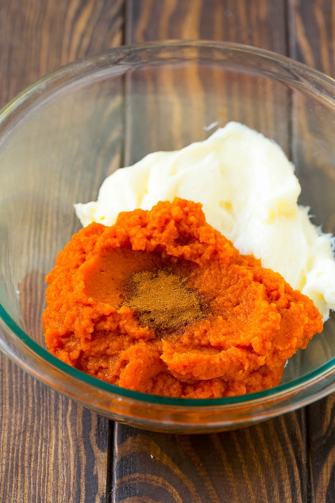 Pumpkin Dip Recipe | Dessert Dip | Pumpkin Pie Dip #pumpkin #dessert #dip #fall #thanksgiving #sadud Puree, cream cheese and spices in a bowl.