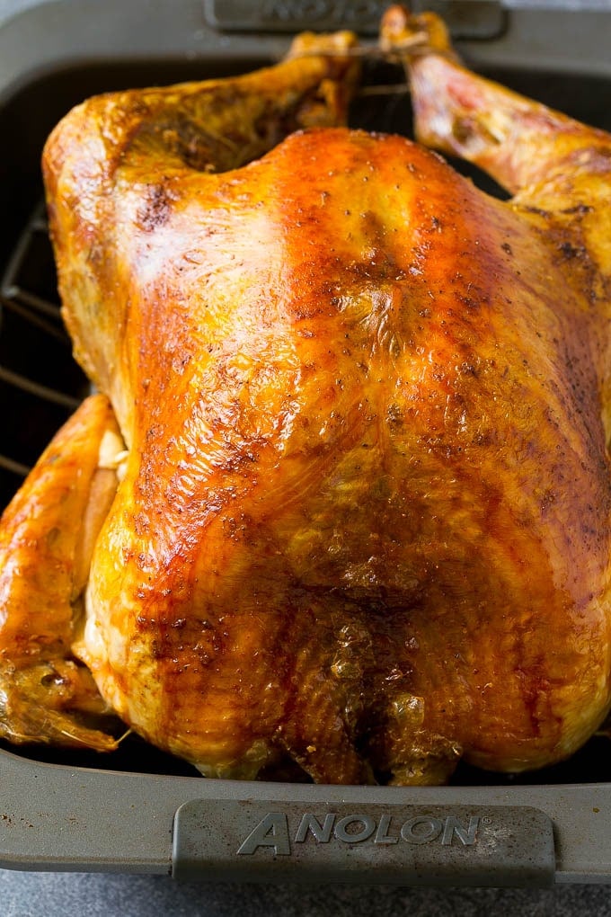 Roast Turkey Recipe | Thanksgiving Turkey | Holiday Turkey | Baked Turkey #turkey #thanksgiving #christmas #dinner #glutenfree #sadud A roasted turkey in a baking pan.