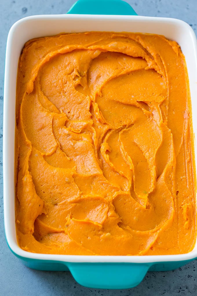 Ruth's Chris Sweet Potato Casserole Recipe | Sweet Potato Casserole | Mashed Sweet Potatoes #sweetpotatoes #casserole #thanksgiving #christmas #holidays #dinner #sadud #sidedish A pan of mashed sweet potatoes.