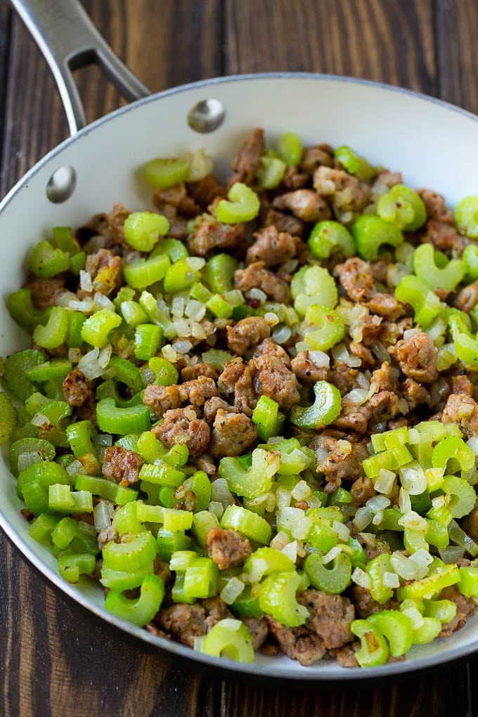 Sausage Stuffing Recipe | Thanksgiving Stuffing | Make Ahead Stuffing #stuffing #thanksgiving #sausage #sidedish #dinner #sadud A pan of cooked sausage, celery and onions.