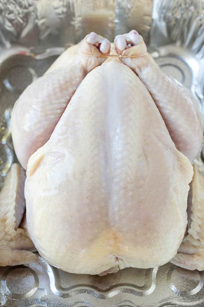 Smoked Chicken Recipe | Whole Smoked Chicken | BBQ Chicken #chicken #smoker #BBQ #dinner #sadud #glutenfree #lowcarb Raw poultry in a roasting pan.