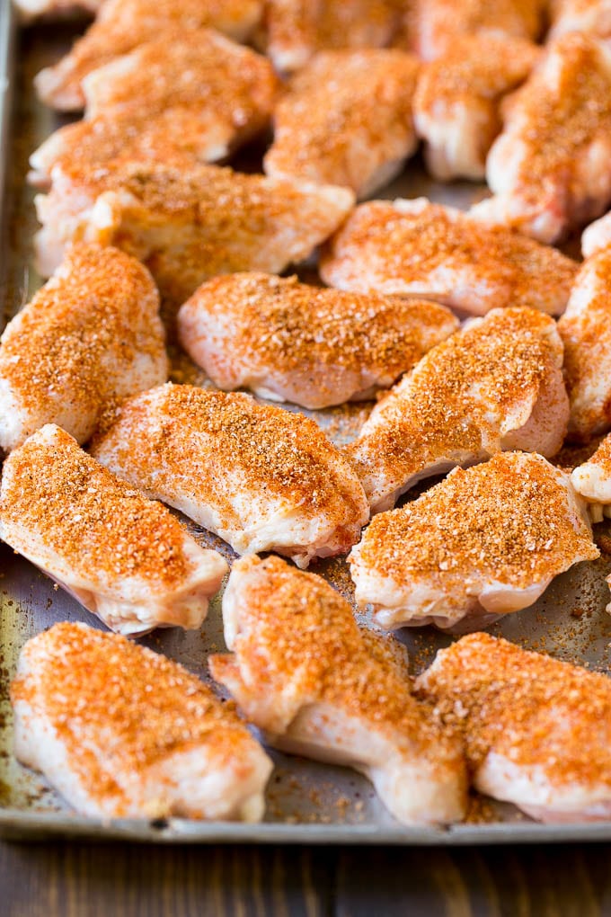 Smoked Chicken Wings | Barbecue Chicken Wings | BBQ Chicken Wings #chicken #wings #bbq #barbecue #appetizer #dinner #sadud Raw chicken wings coated in homemade spice rub on a sheet pan.