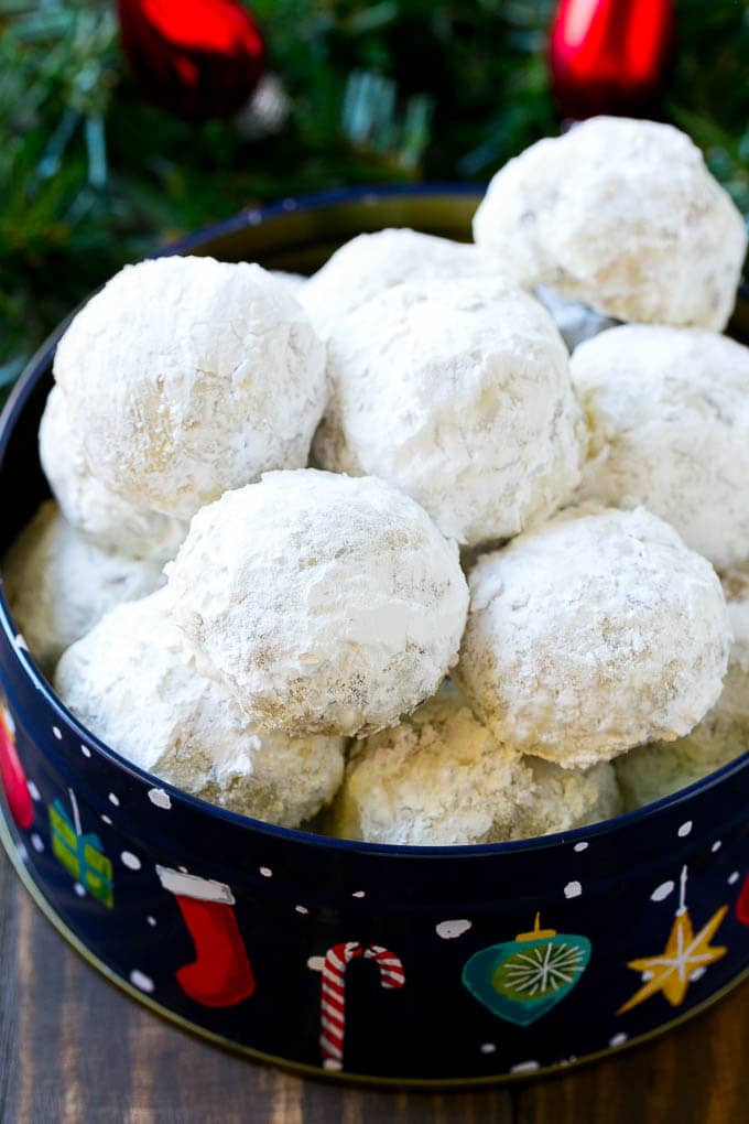 Snowball Cookies Recipe | Mexican Wedding Cookies | Russian Tea Cakes #cookies #pecan #chocolate #baking #dessert #christmas #sadud Snowball cookies coated in powdered sugar and served in a holiday tin,