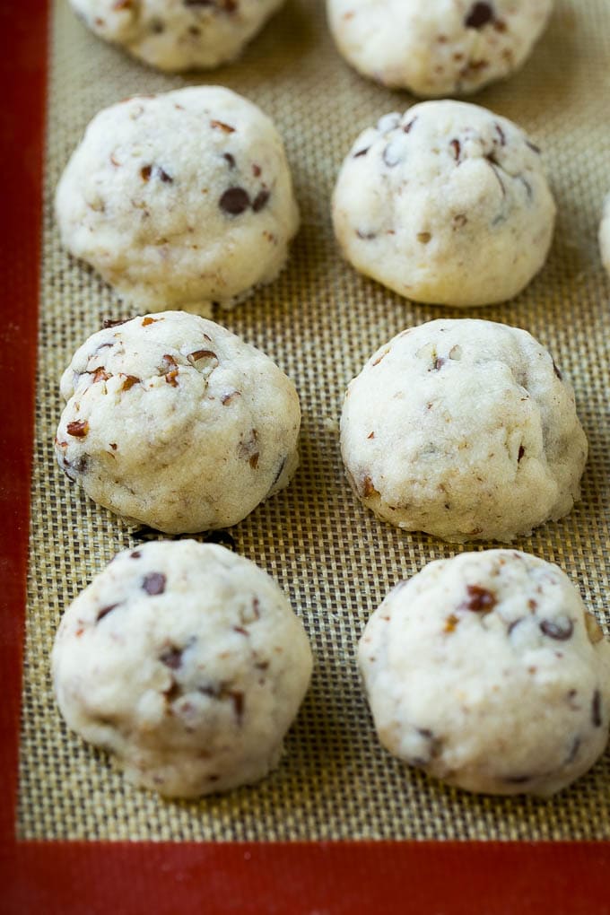 Snowball Cookies Recipe | Mexican Wedding Cookies | Russian Tea Cakes #cookies #pecan #chocolate #baking #dessert #christmas #sadud Baked snowball cookies on a sheet pan.