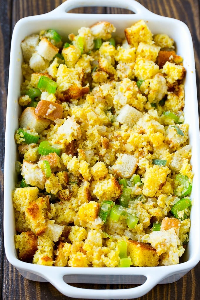 This old fashioned Southern cornbread dressing recipe is a classic that's a must-have for every Thanksgiving table. It's made with celery, onions, homemade cornbread, white bread and plenty of herbs. Cornbread dressing ready to go into the oven to bake.