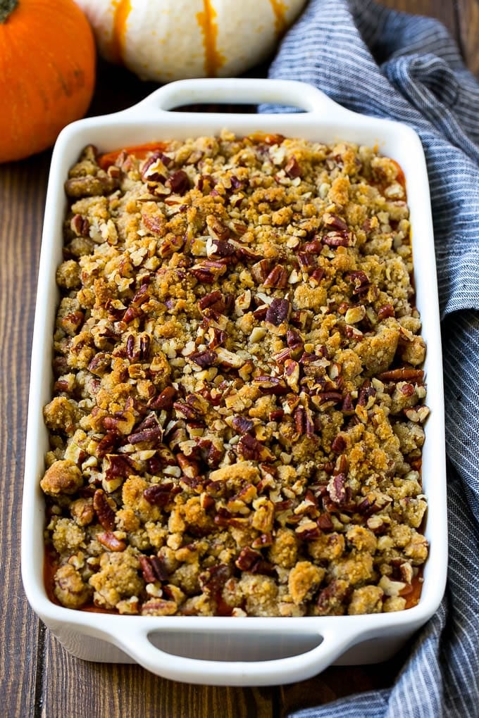 Sweet Potato Casserole with Pecans Recipe | Sweet Potato Casserole | Sweet Potato Side Dish #sweetpotatoes #thanksgiving #pecans #casserole #sidedish #holiday #fall #sadud Sweet potato casserole with pecans and brown sugar streusel in a baking dish.