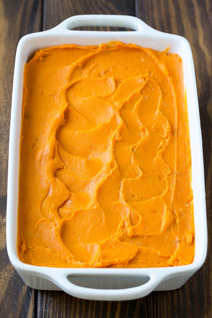 Sweet Potato Casserole with Pecans Recipe | Sweet Potato Casserole | Sweet Potato Side Dish #sweetpotatoes #thanksgiving #pecans #casserole #sidedish #holiday #fall #sadud Mashed sweet potatoes in a baking dish.