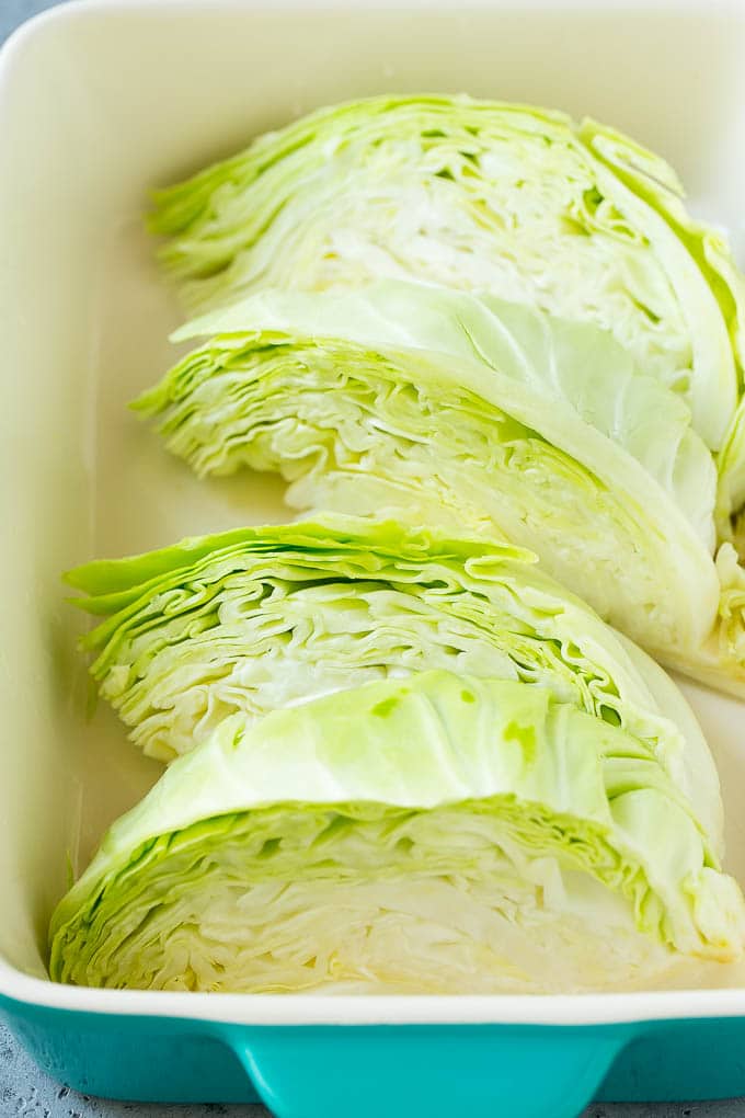 Braised Cabbage Recipe | Easy Cabbage Recipe #cabbage #lowcarb #keto #carrots #veggies #vegetarian #dinner #sadud Wedges of cabbage in a baking dish.