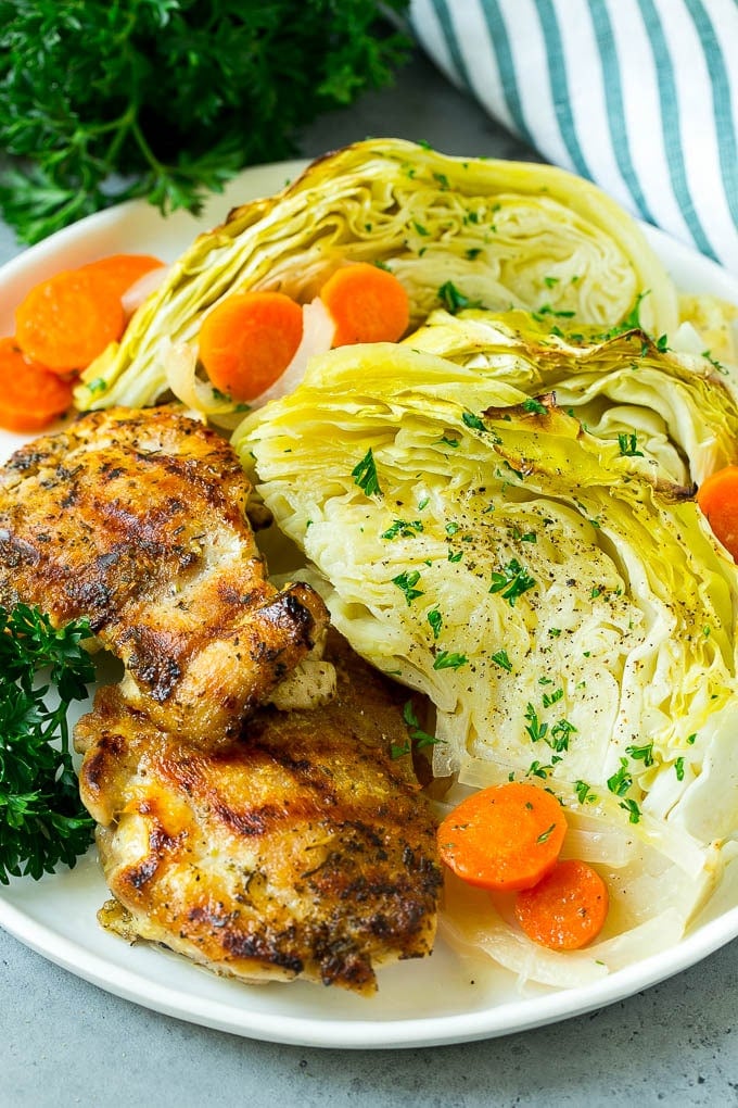 Braised Cabbage Recipe | Easy Cabbage Recipe #cabbage #lowcarb #keto #carrots #veggies #vegetarian #dinner #sadud A plate of grilled chicken along with braised cabbage, carrots and onions.