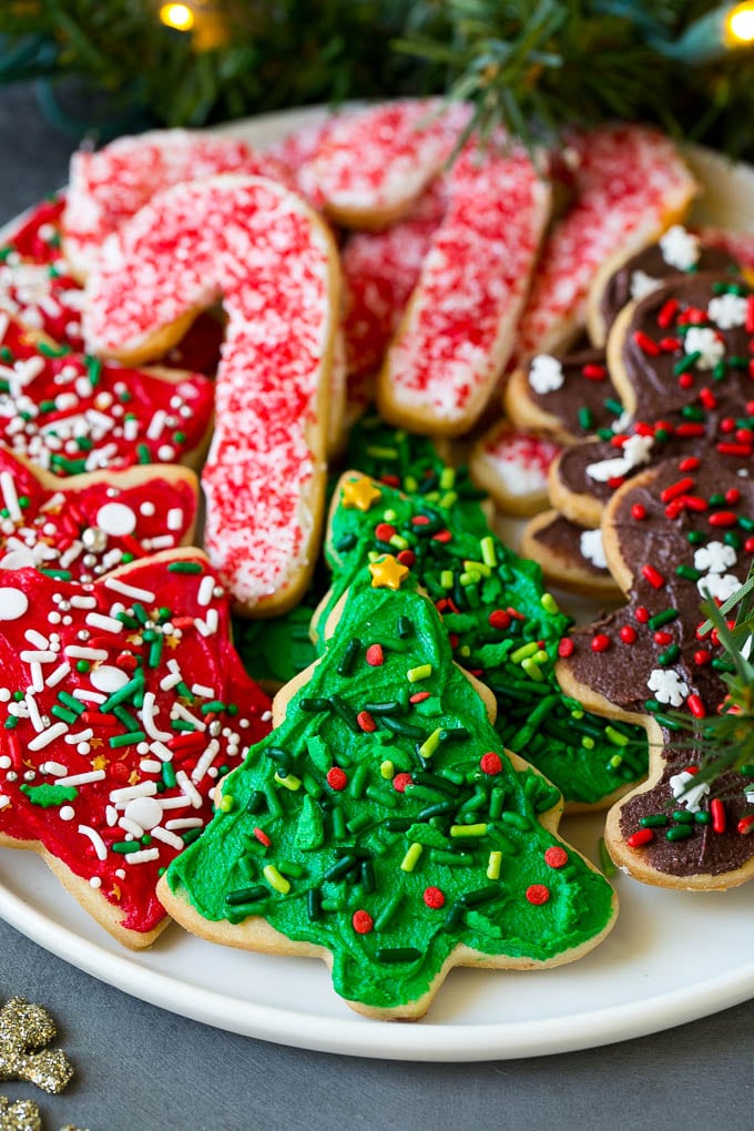 Christmas Sugar Cookies Recipe | Christmas Cookies #cookies #frosting #sprinkles #sugarcookies #christmas #dessert #sadud A serving plate of Christmas sugar cookies decorated with frosting and sprinkles.