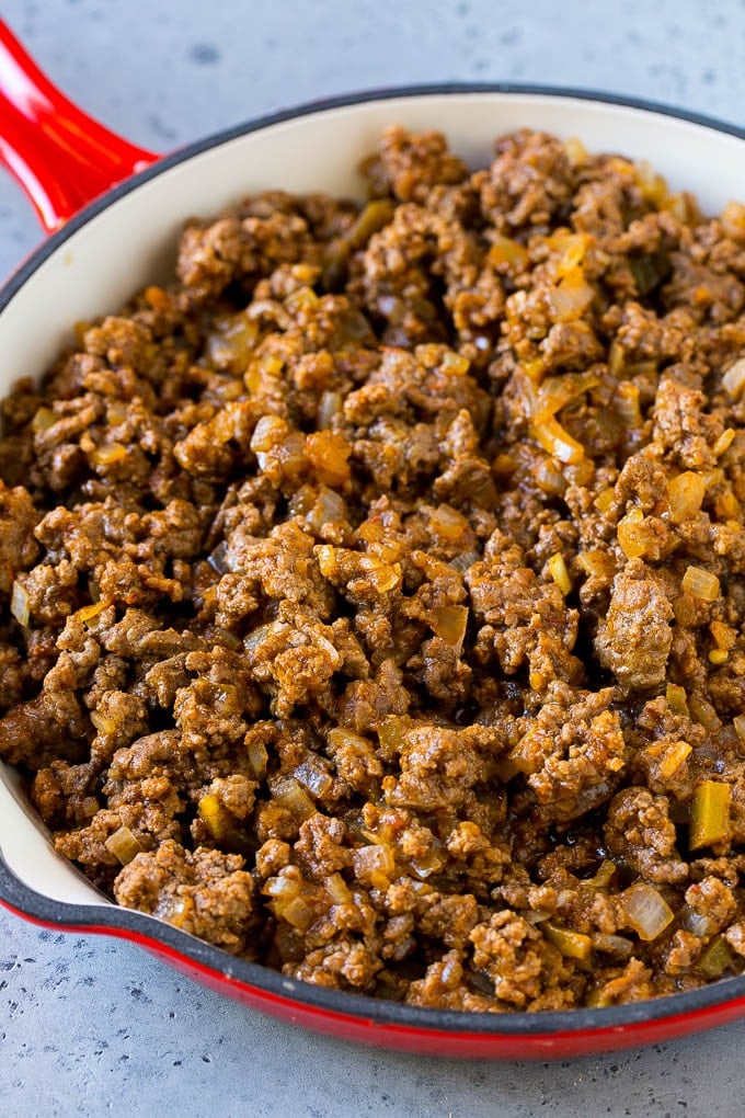 Dorito Casserole Recipe | Mexican Casserole | Beef Casserole #mexicanfood #beef #groundbeef #casserole #dinner #sadud Ground beef, onions and salsa in a skillet.