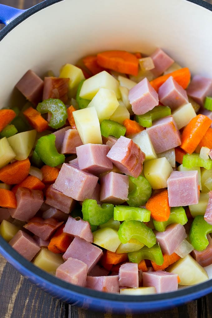 Ham and Potato Soup | Ham Soup | Potato Soup #soup #ham #potato #dinner #comfortfood #sadud Diced ham, carrots, potatoes and celery in a soup pot.