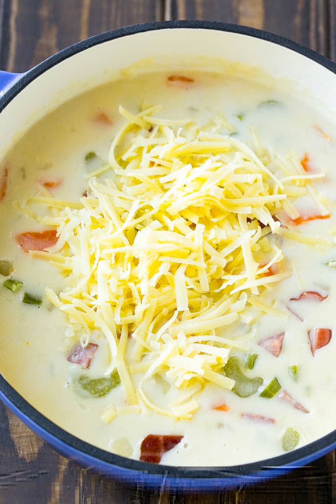 Ham and Potato Soup | Ham Soup | Potato Soup #soup #ham #potato #dinner #comfortfood #sadud Shredded white cheddar cheese to be stirred into ham and potato soup.