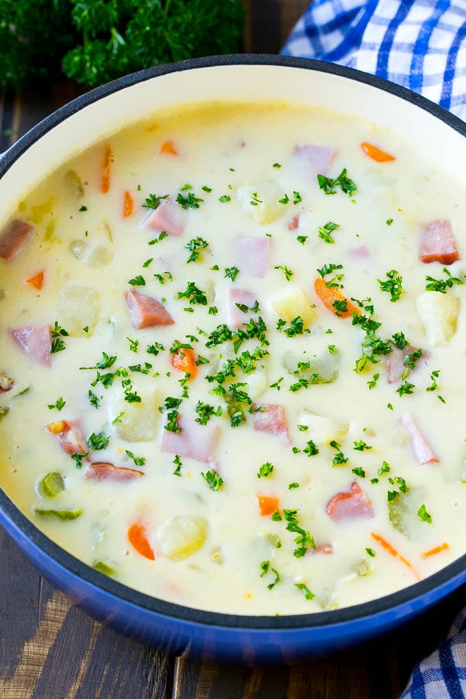 Ham and Potato Soup | Ham Soup | Potato Soup #soup #ham #potato #dinner #comfortfood #sadud A pot of ham and potato soup with vegetables in a creamy broth, topped with parsley.
